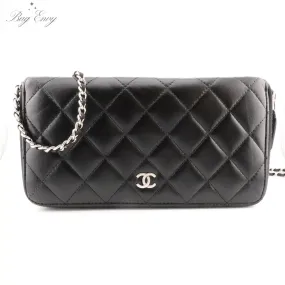 CHANEL Black Quilted Lambskin Zip Wallet with Added Chain